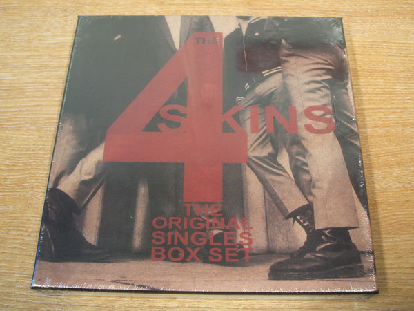 the 4 skins The Original Singles Box Set 4 x coloured 7" classics